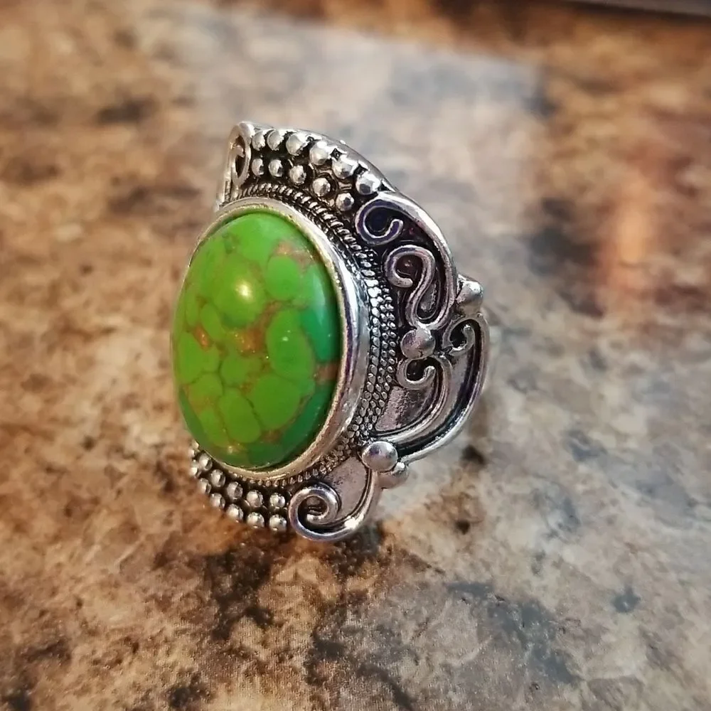 Inlaid turquoise egg shape carved ring size 8